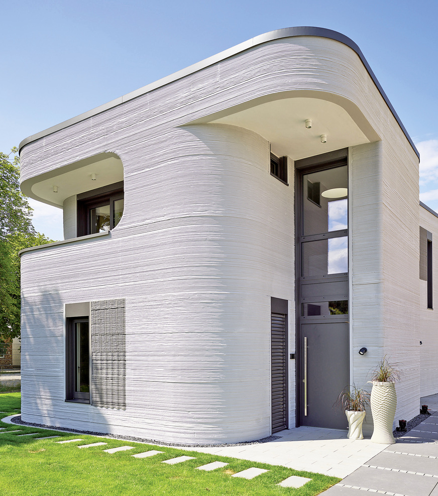 Die Umhüllung des Heizkamins „Speedy Ph“ von Spartherm wurde bereits im Rohbau im 3D-Druck gefertigt.&nbsp;Das macht ihn zu einem integralen Bestandteil des Hauses.