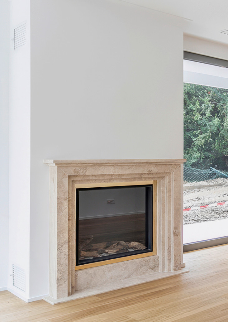 ... oder so ein klassischer Natursteinkamin an der Außenfassade.